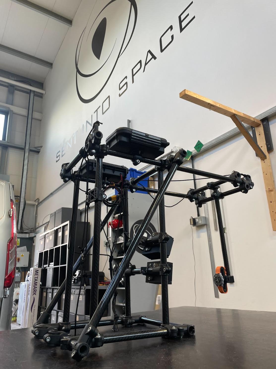 The carbon fiber rig for the MoonSwatch