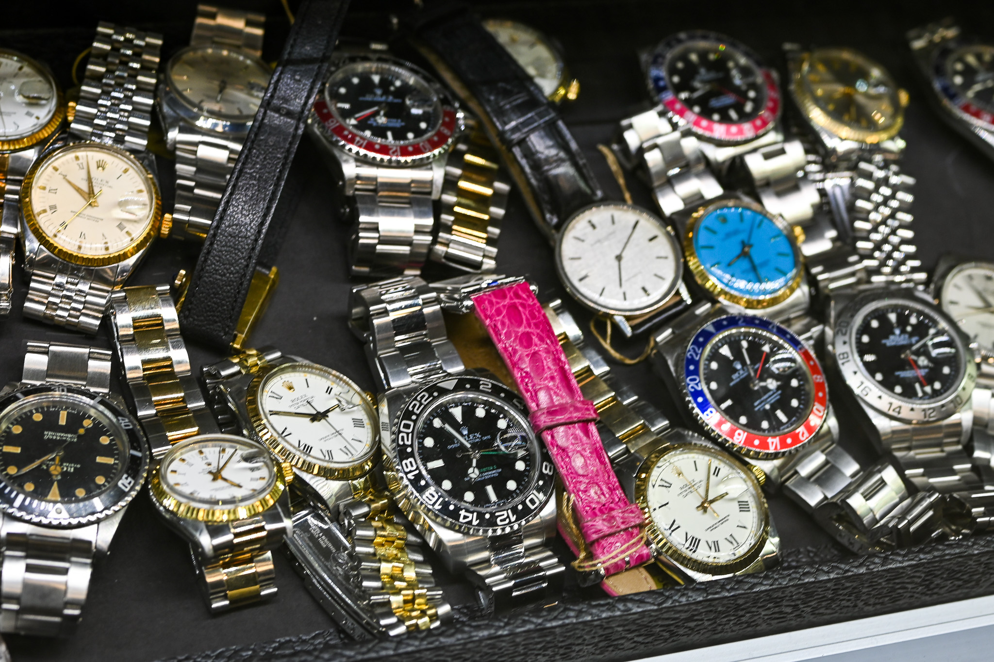 rolex pile of watches