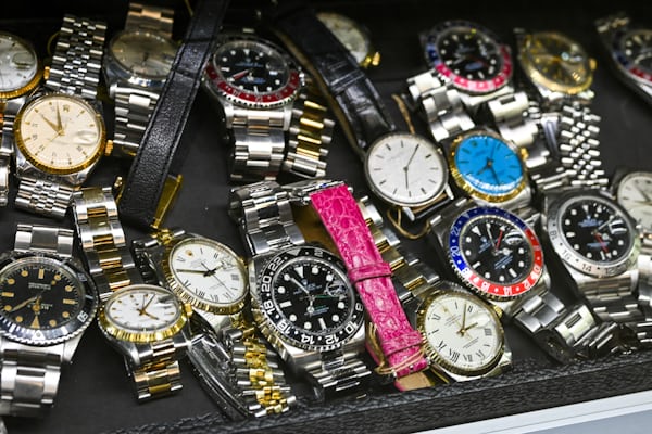 rolex pile of watches