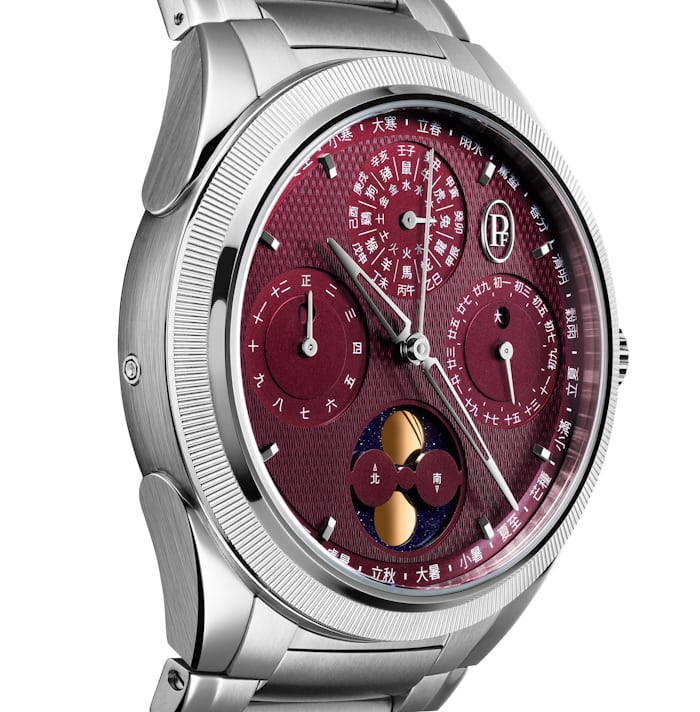 The red dial of a Parmigiani watch with chinese characters