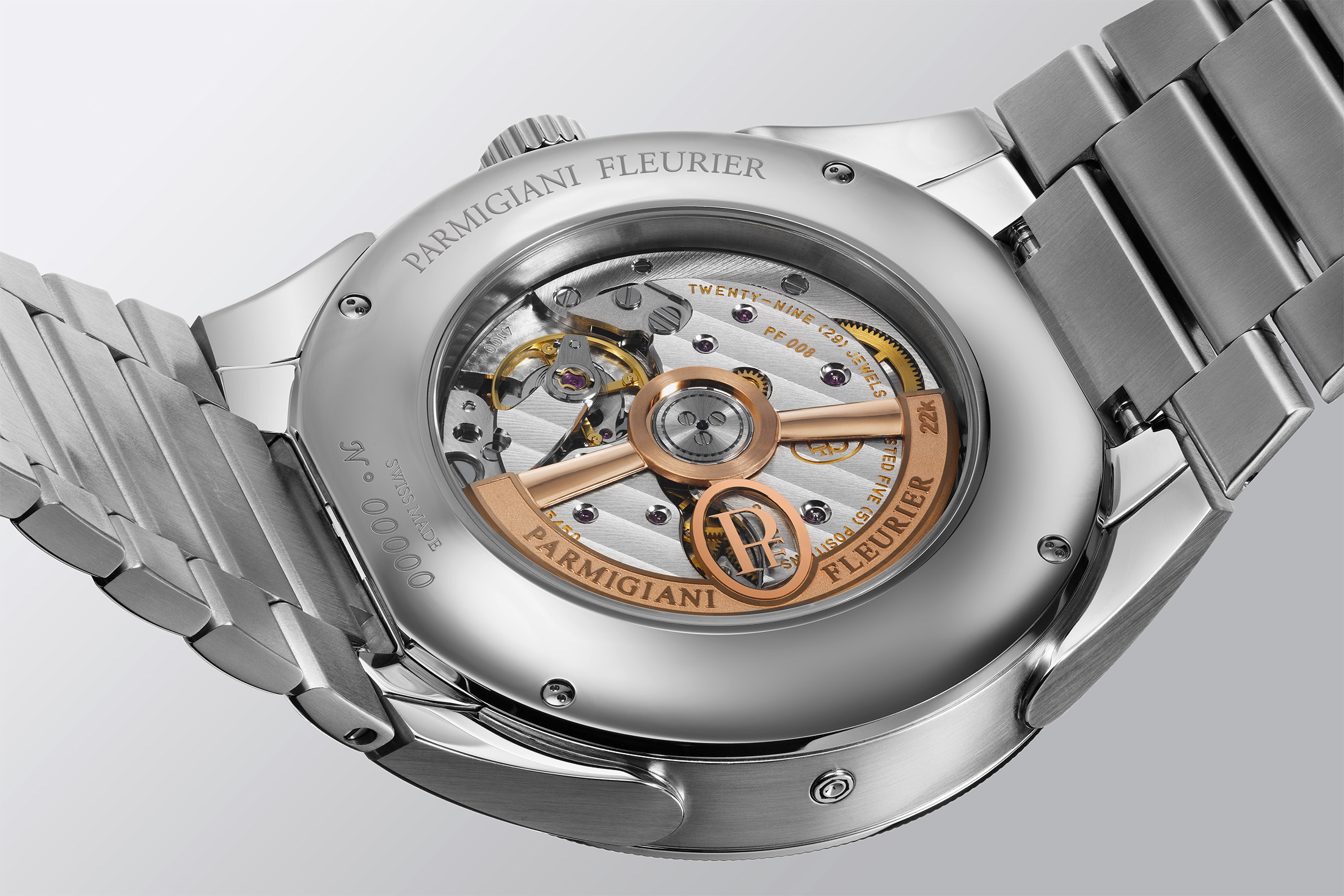 The movement of a watch seen through the case back