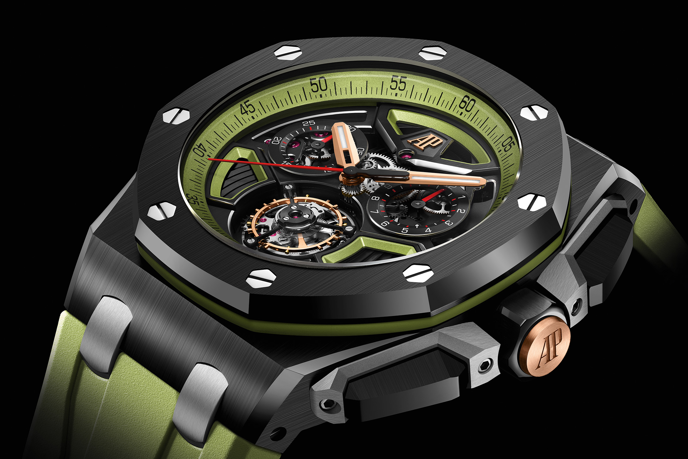 A black ceramic watch with gold and green accents