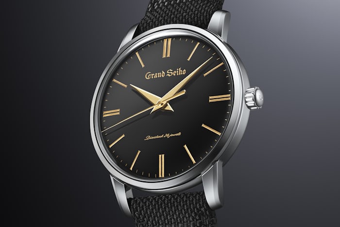 The Grand Seiko SBGW295 watch with gold accents