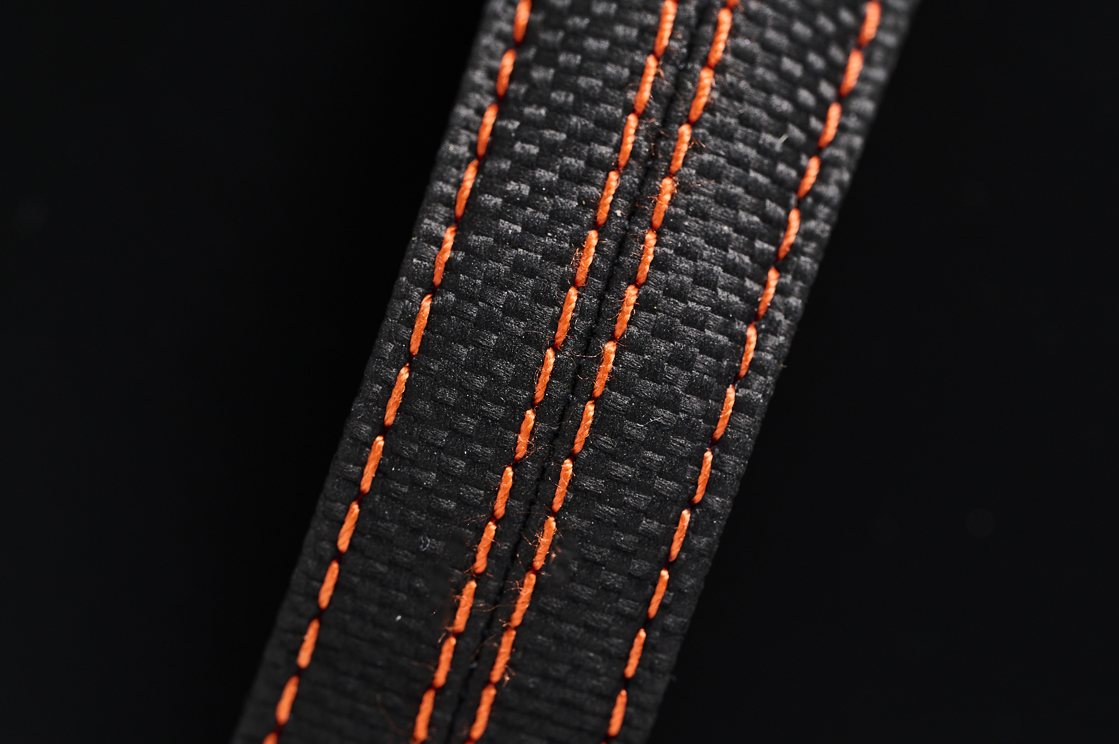 The orange strap of the watch