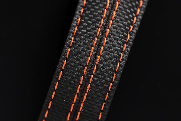 The orange strap of the watch