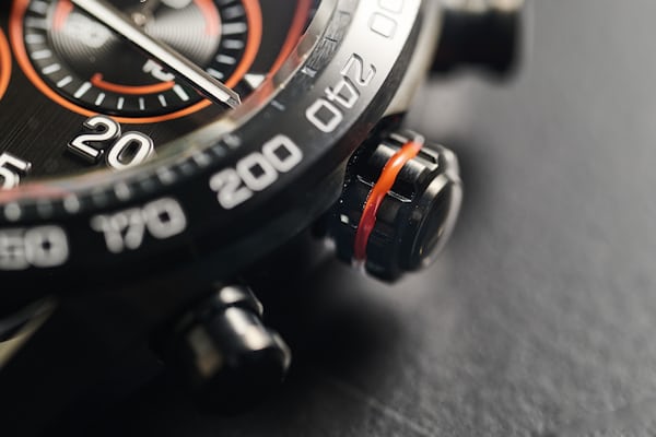 The orange crown of the TAG Heuer Carrera