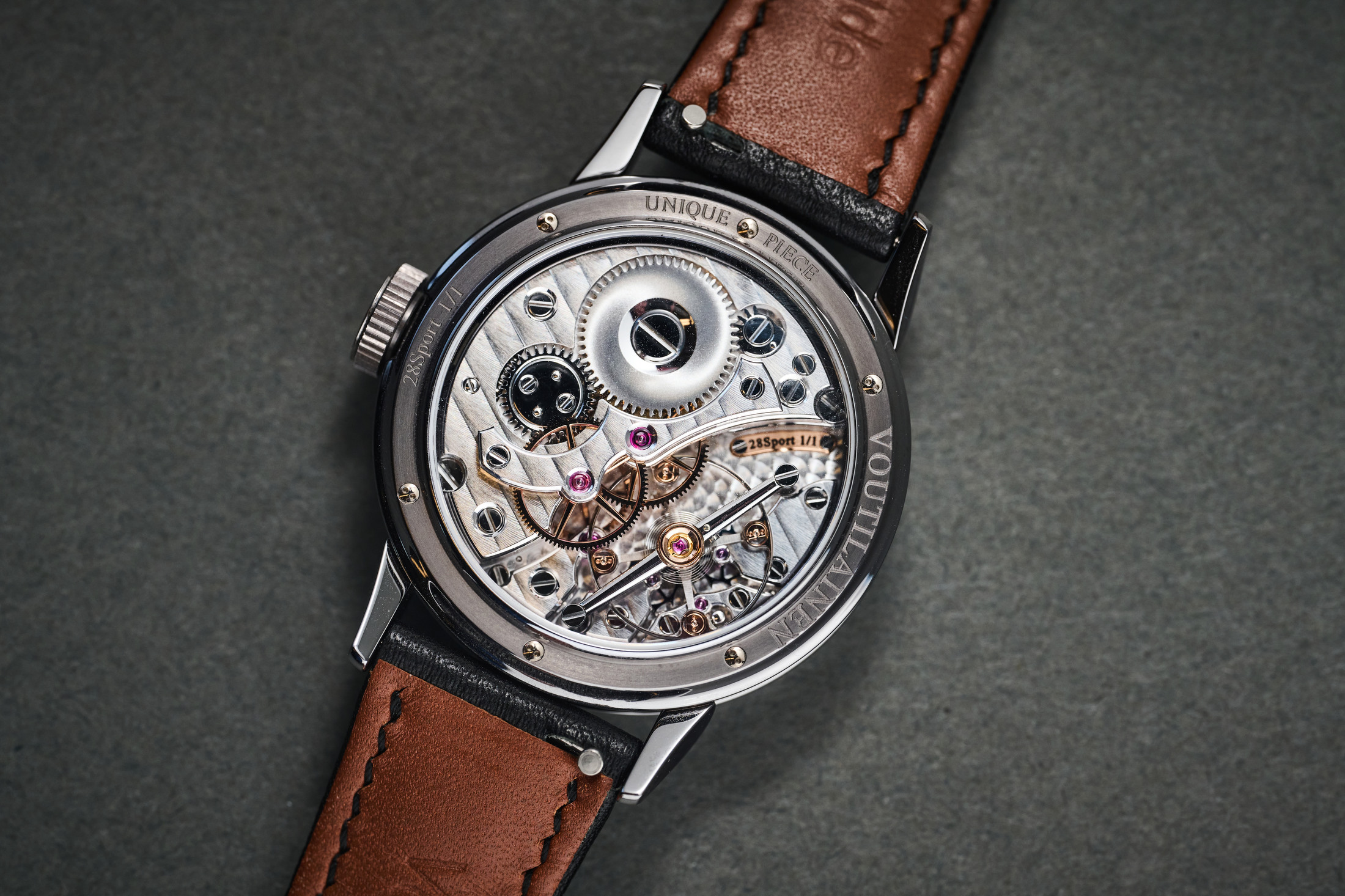 Kari Voutilainen's personal unique 28Sport wristwatch movement, laying on a table