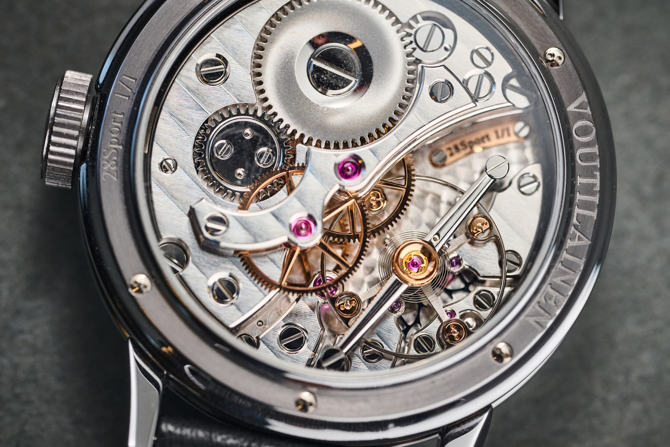 Kari Voutilainen's personal unique 28Sport wristwatch movement, laying on a table