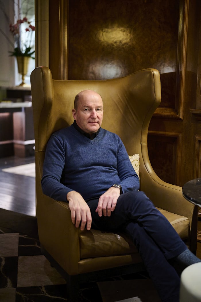 Kari Voutilainen sitting in a chair in a hotel lounge