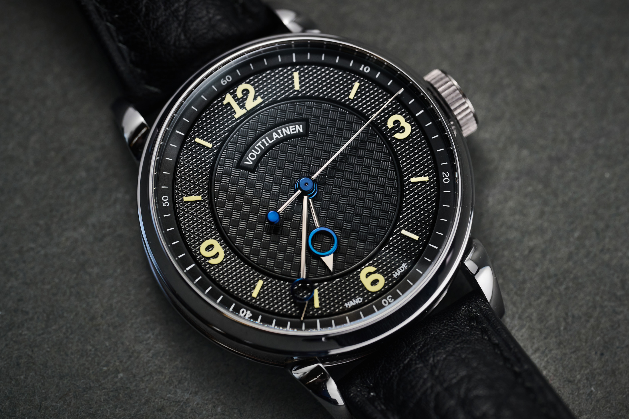 Kari Voutilainen's personal unique 28Sport wristwatch, held in the hand.