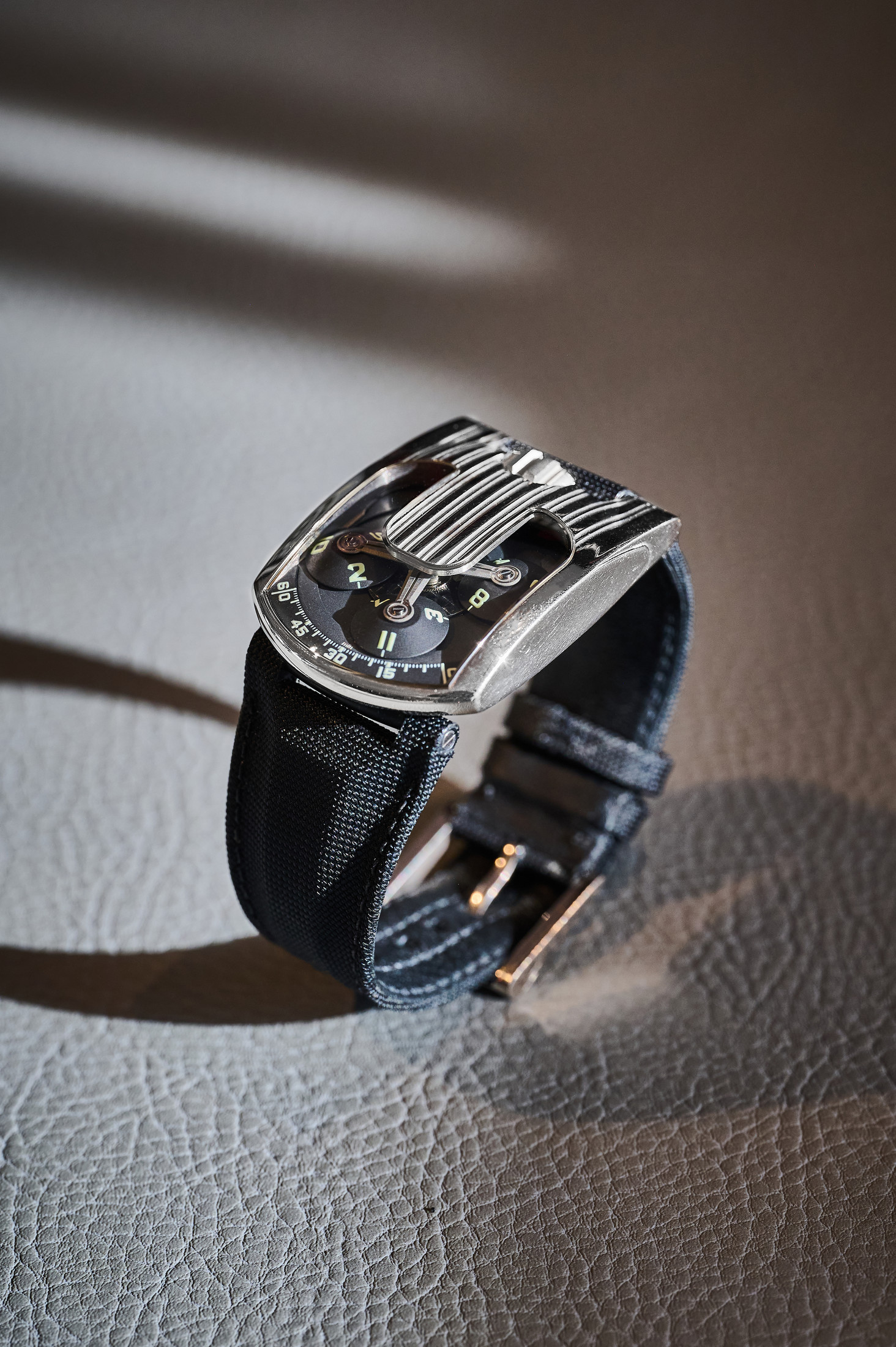 The Urwerk UR-103 watch on a table