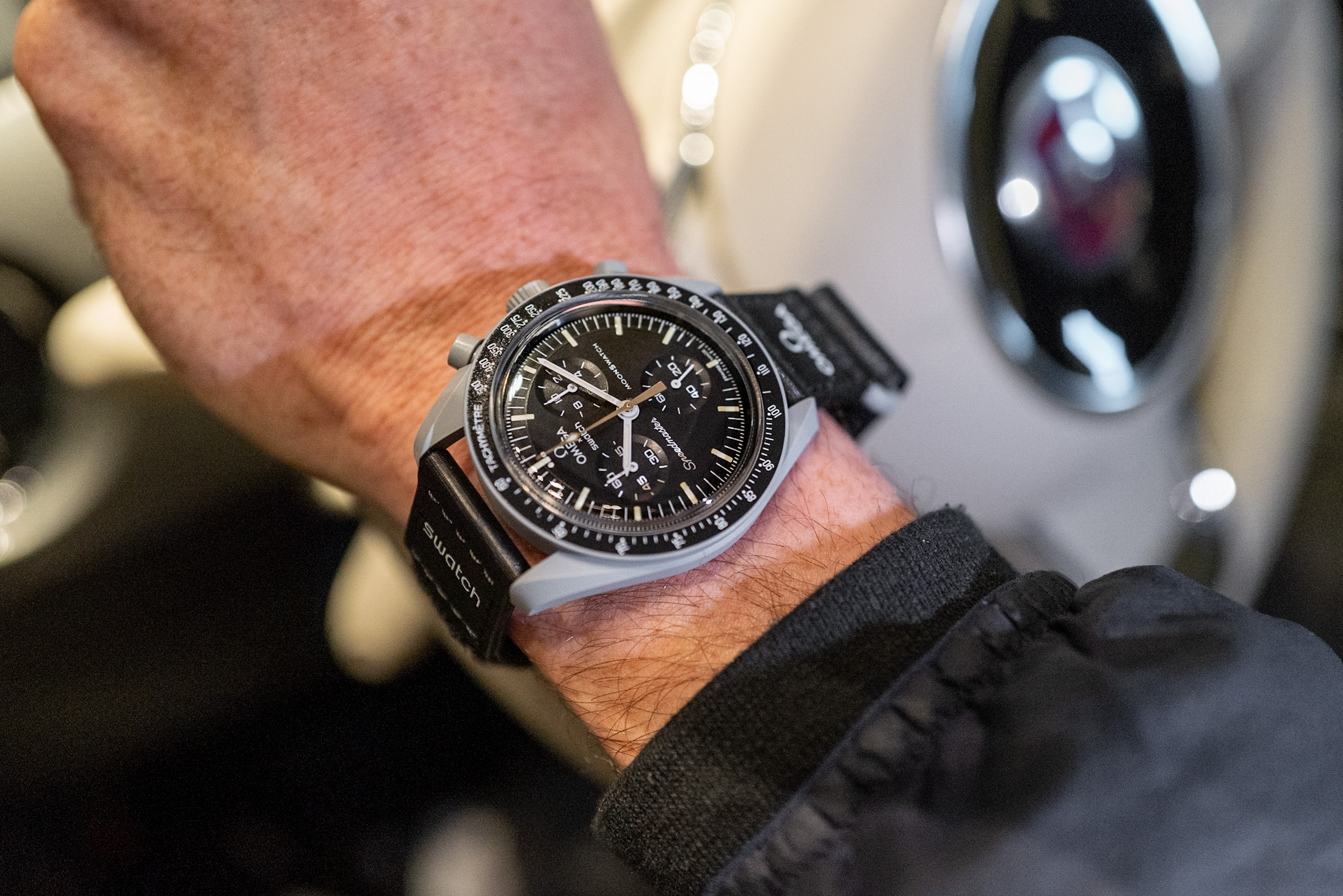 Moonshine MoonSwatch on wrist