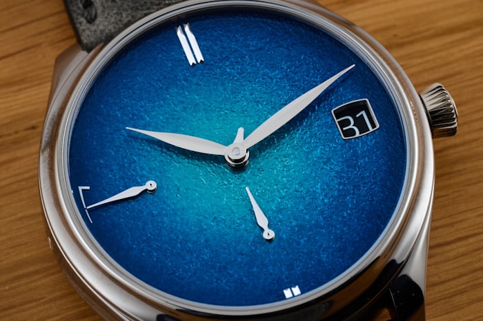 The blue dial of the new Moser Endeavor Perpetual Calendar with fumé grand feu enamel dial