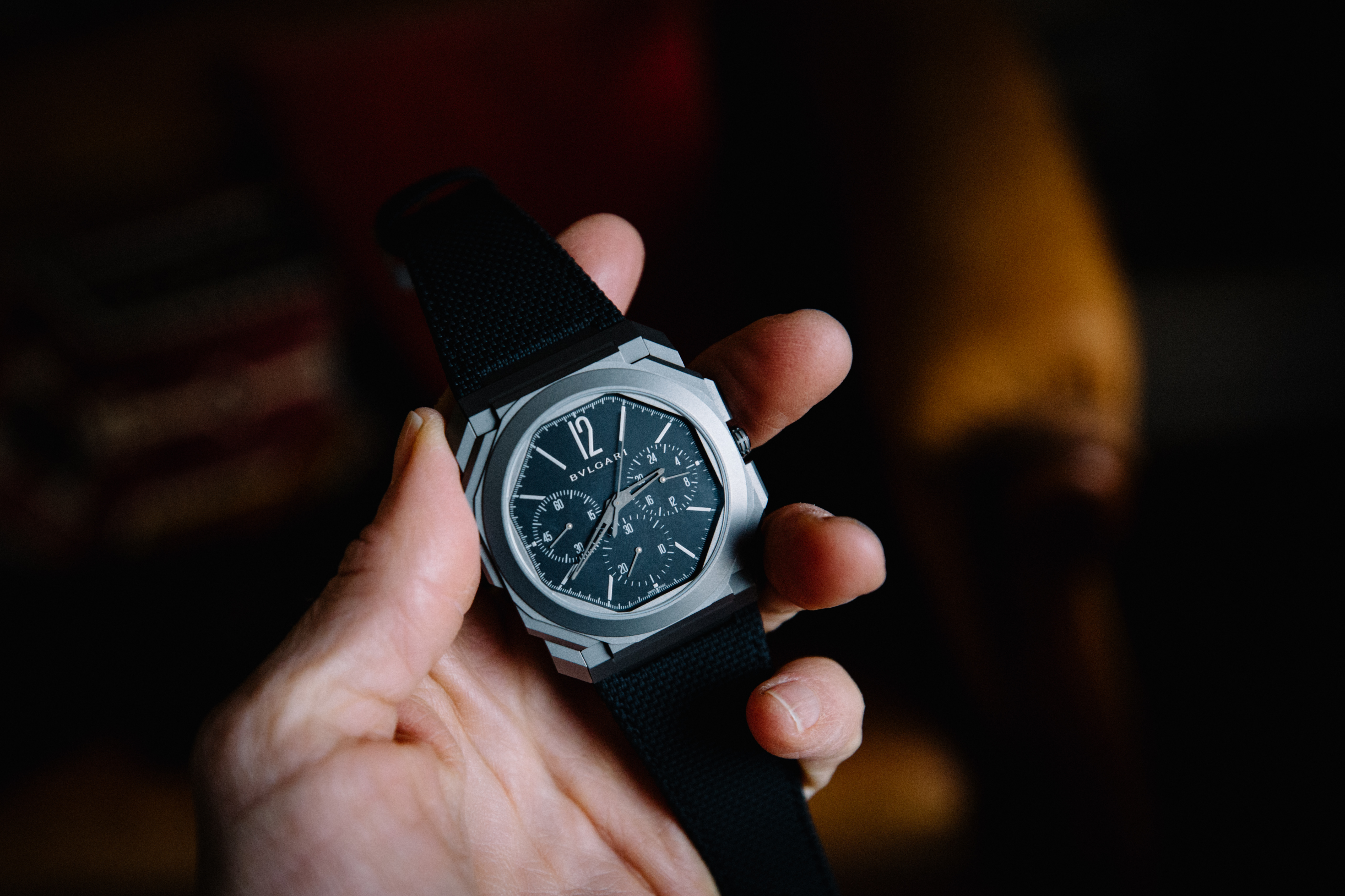 Someone holding a bulgari octofinissimo watch 