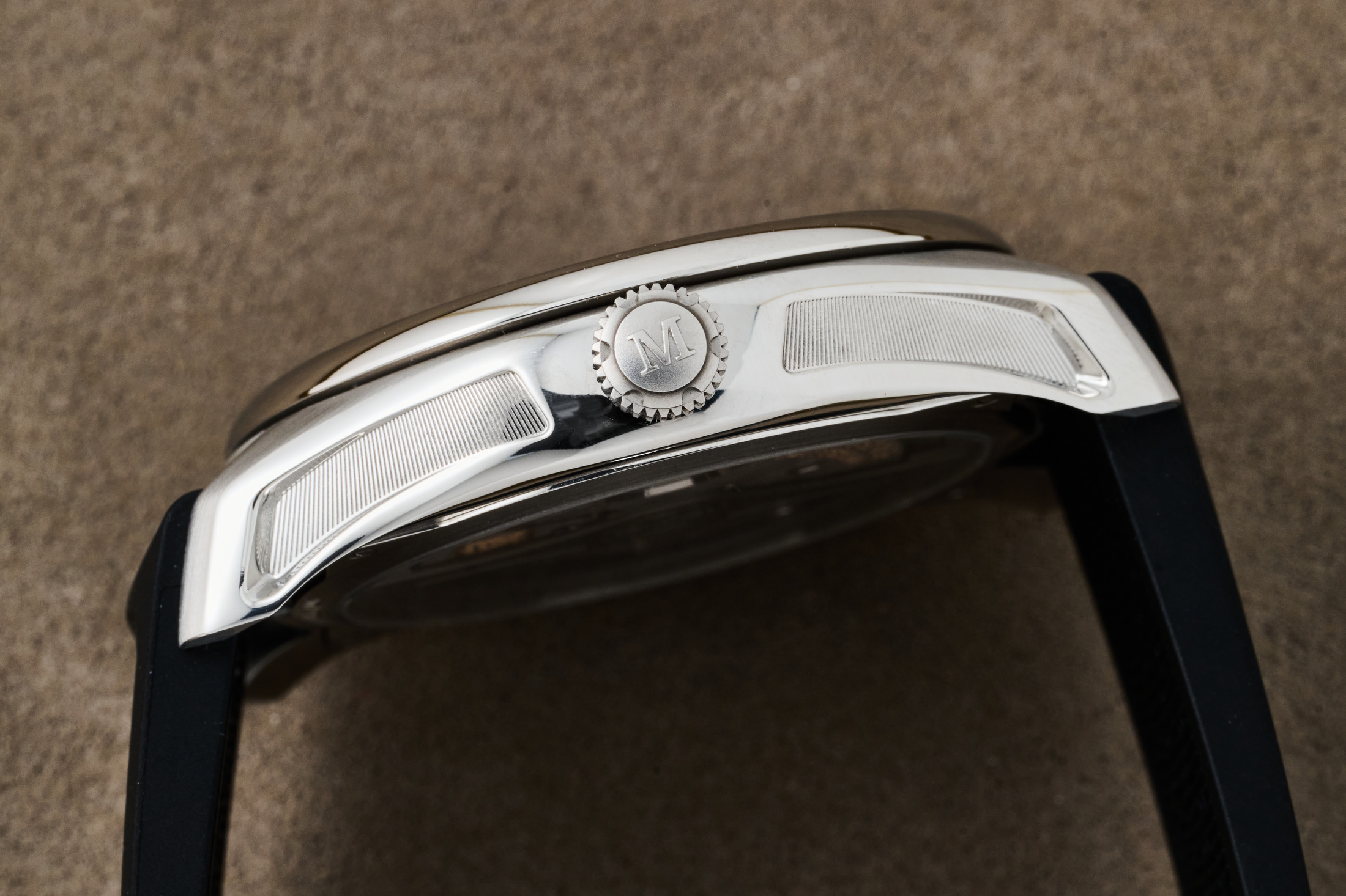 The side of case and crown on the Moser Pioneer Center Seconds