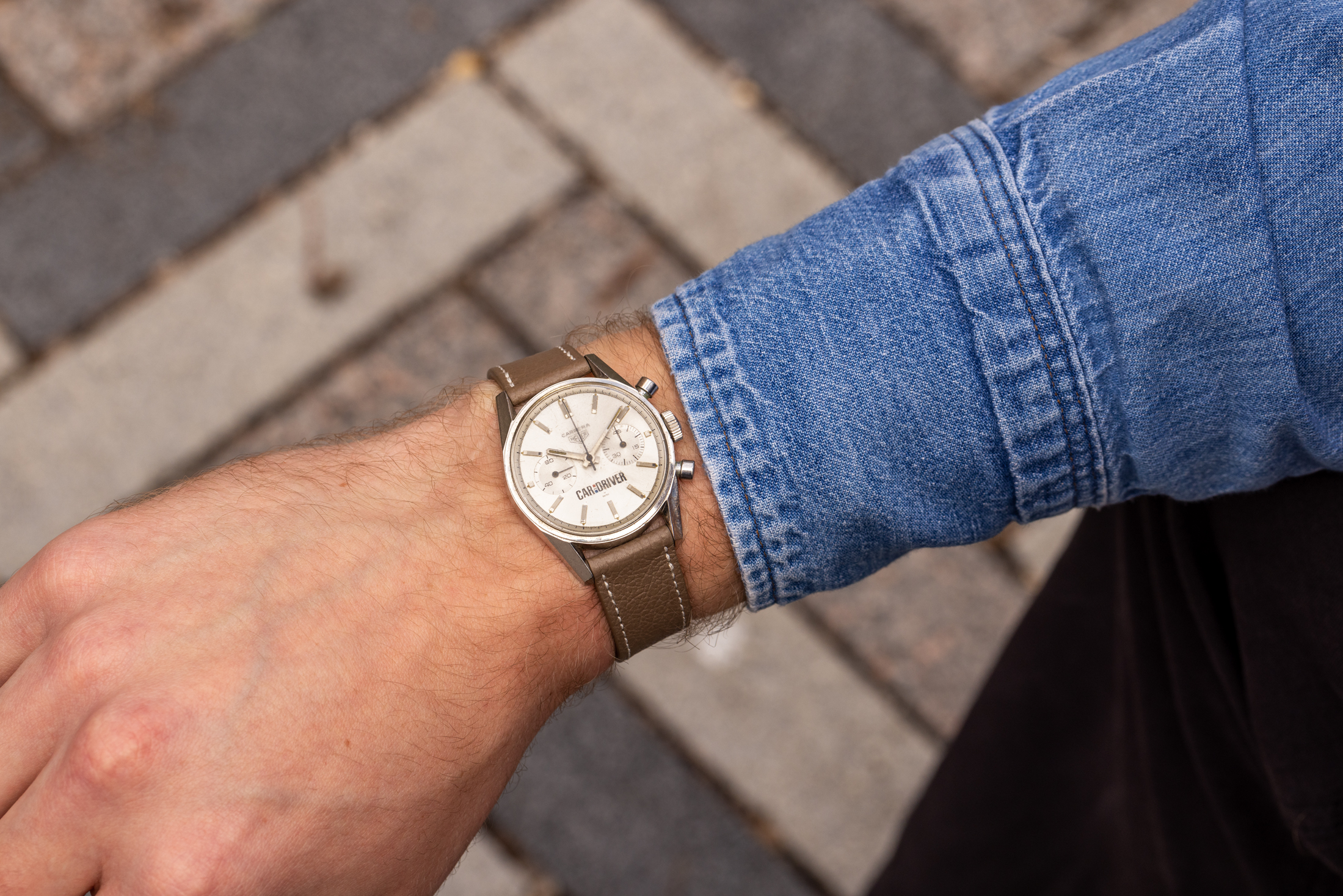A vintage Heuer Carrera with Car and Driver dial on the wrist