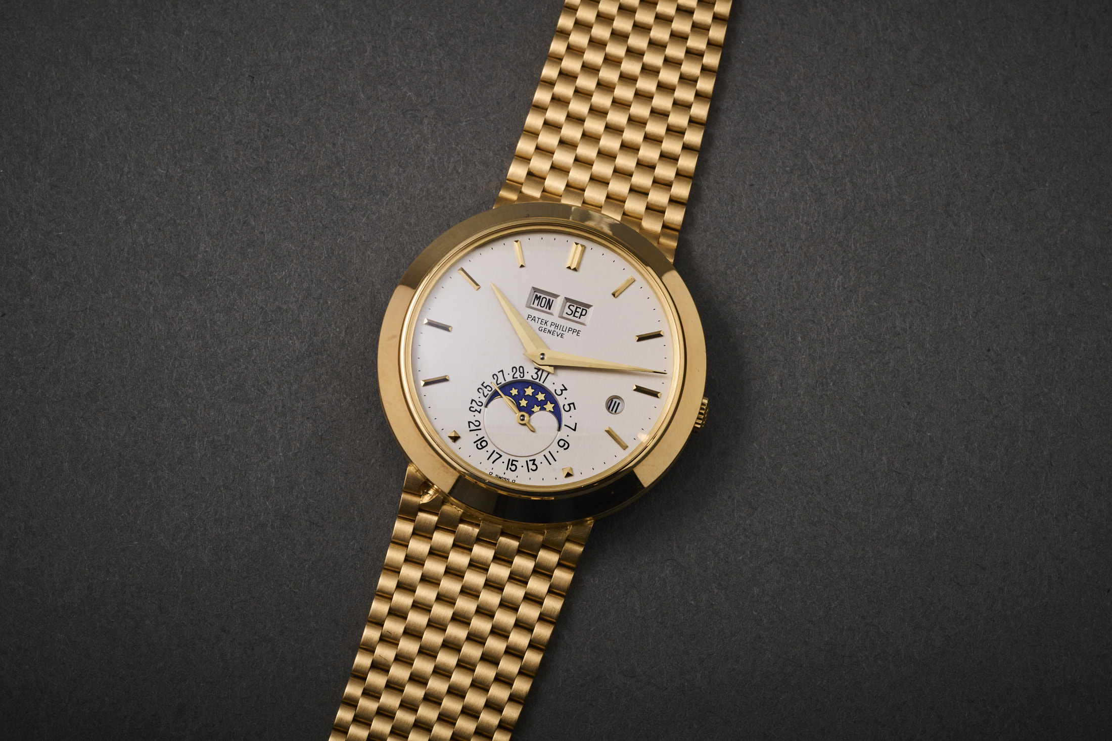 A Patek 3450 perpetual calendar with integrated bracelet