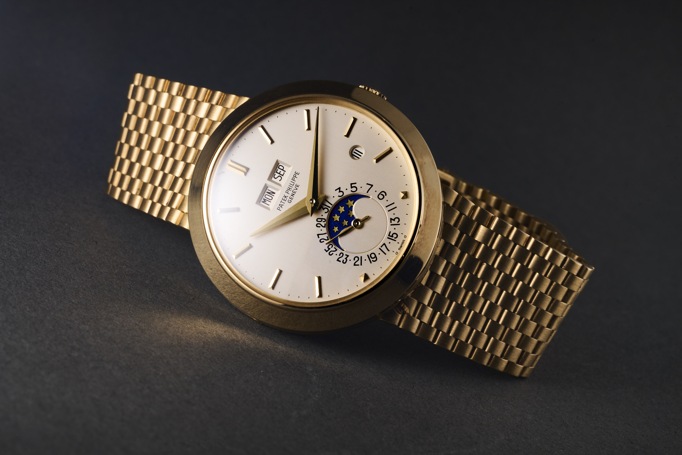 A Patek 3450 perpetual calendar with integrated bracelet