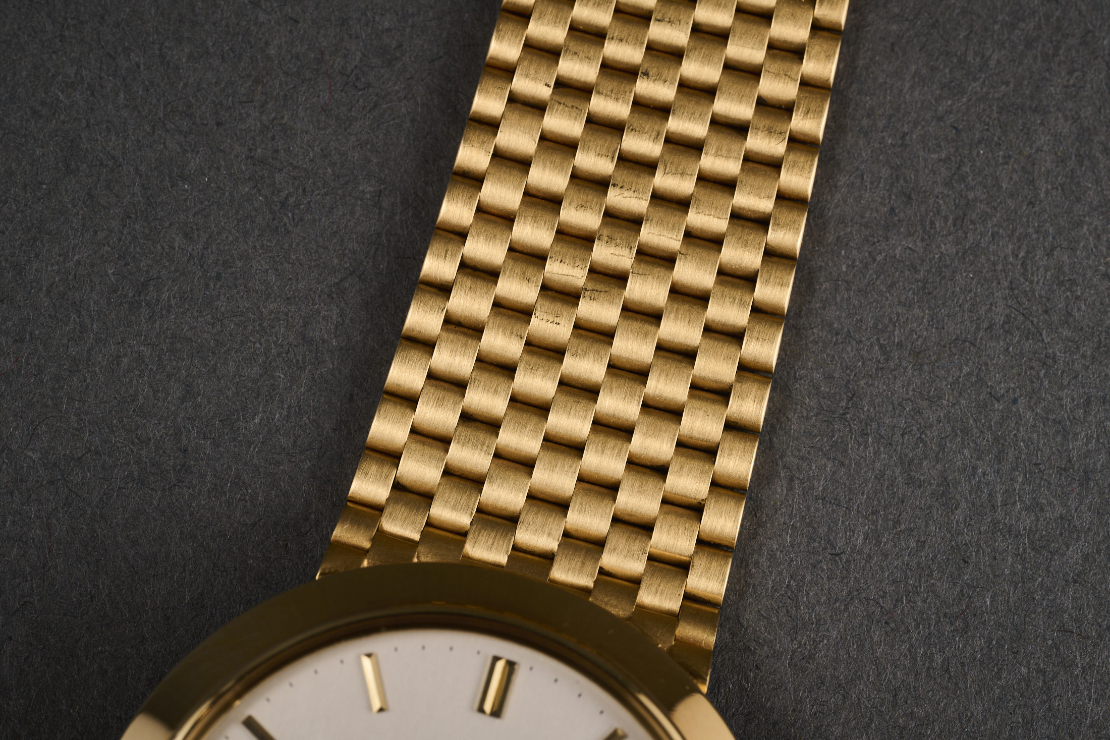 A Patek 3450 perpetual calendar with integrated bracelet