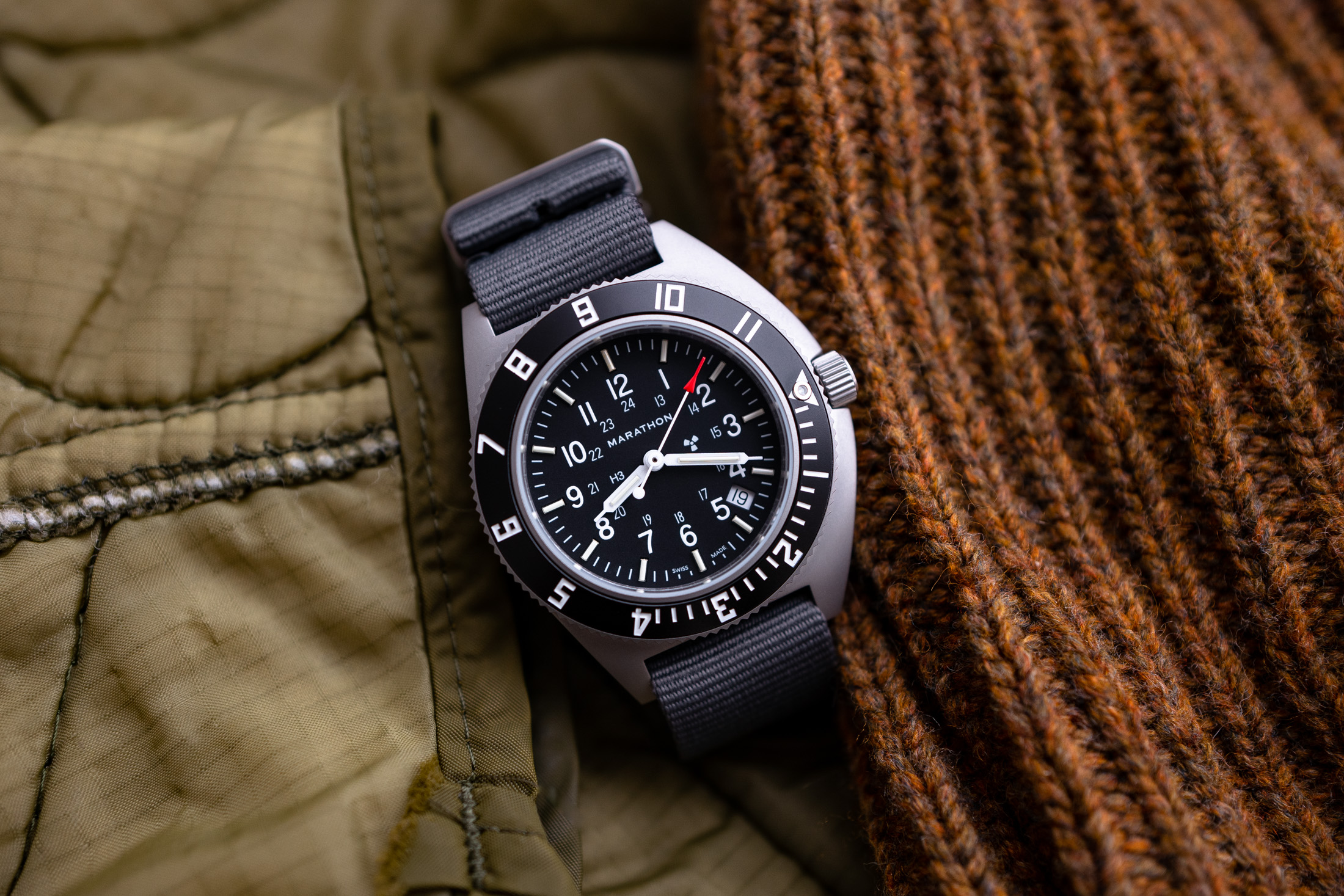 The movement also features ETA's PreciDrive thermo-compensation and the HeavyDrive system, which can detect a shock to the movement and use the motor to prevent the hands from skipping. The movement is mounted in the case using a screwed metal movement mo