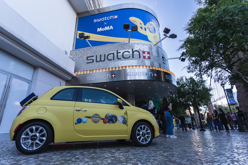 Outside of Swatch store with car