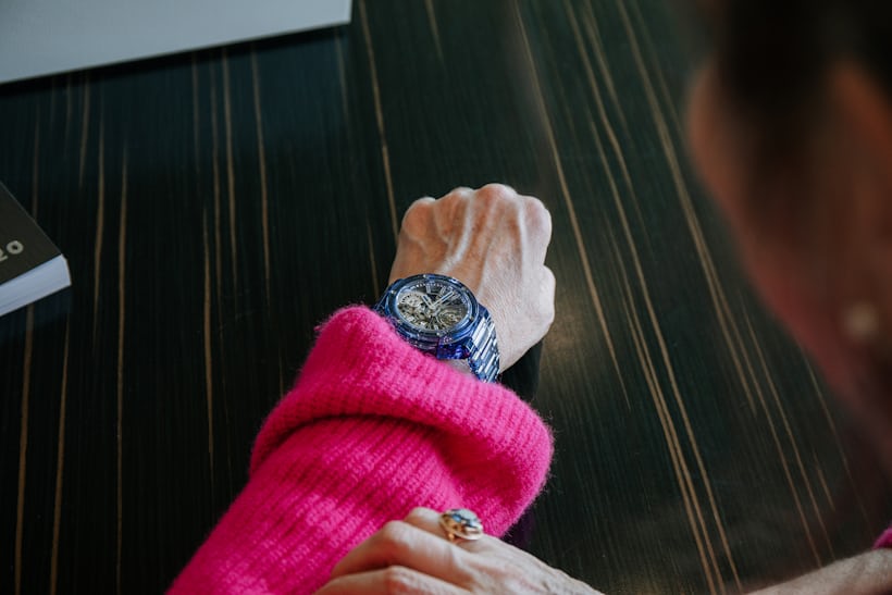 a blue hublot watch on the author's wrist