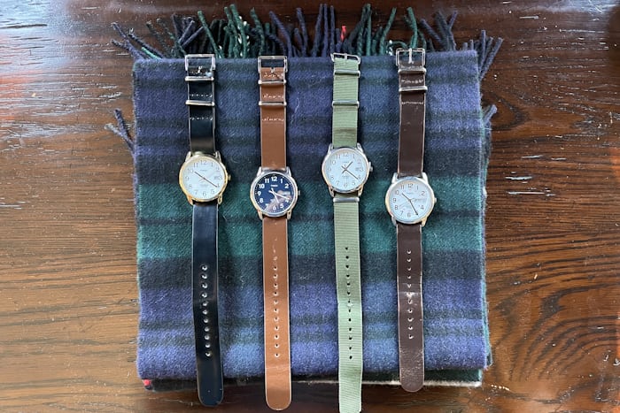 A collection of Timex Easy Readers on a watch roll up 