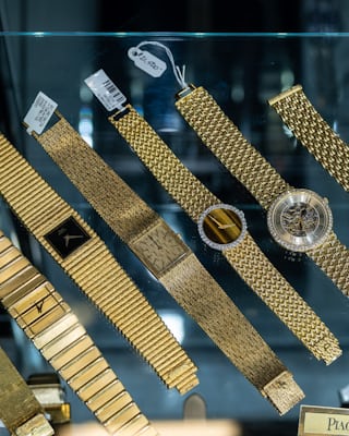 row of gold watches