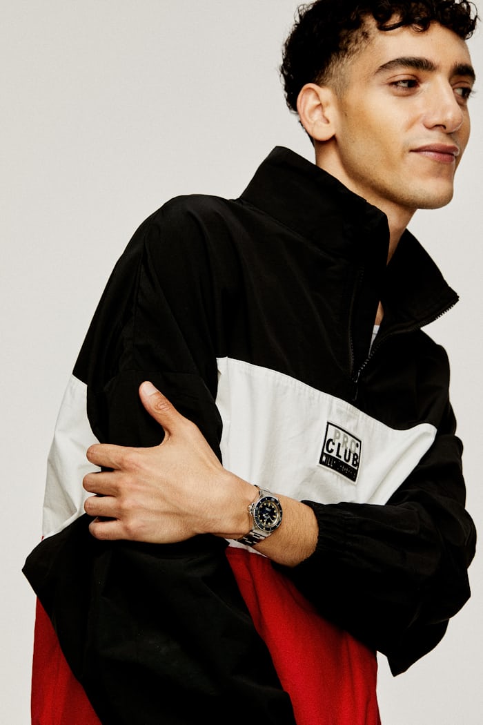 Model in Willy Chavarria and Tudor watch