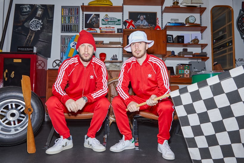 two men in red track suits