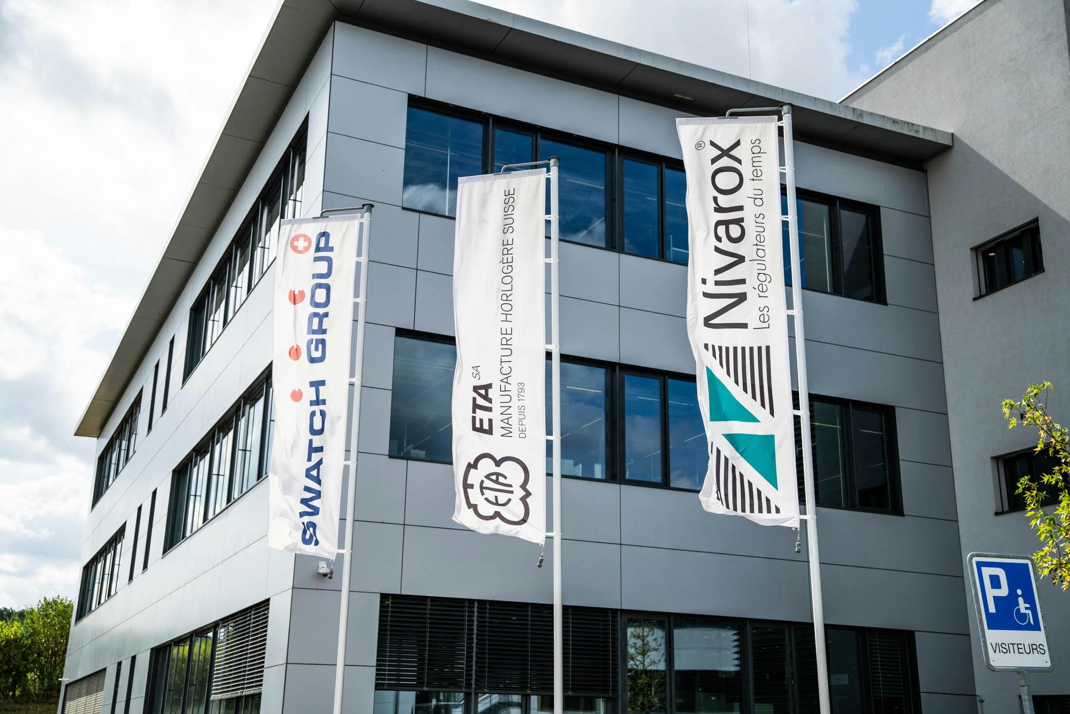 The brand flags outside ETA Boncourt facility.