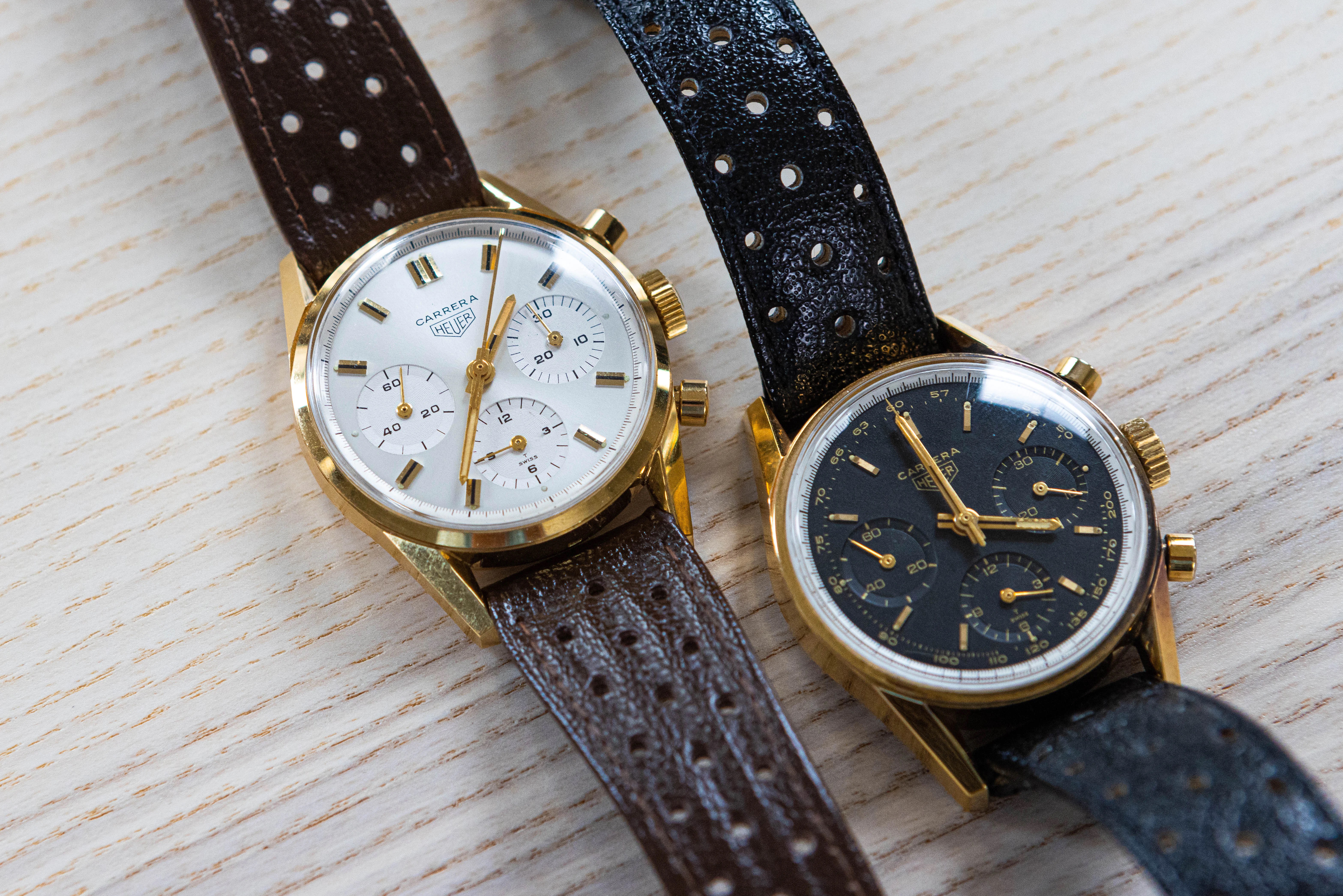 Two carreras with gold finishings laid out on a wooden surface