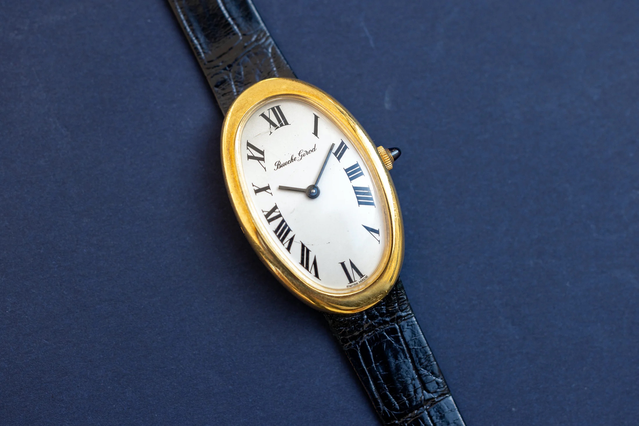 Elliptical watch with an inscription that reads "Bueche Girod" in script
