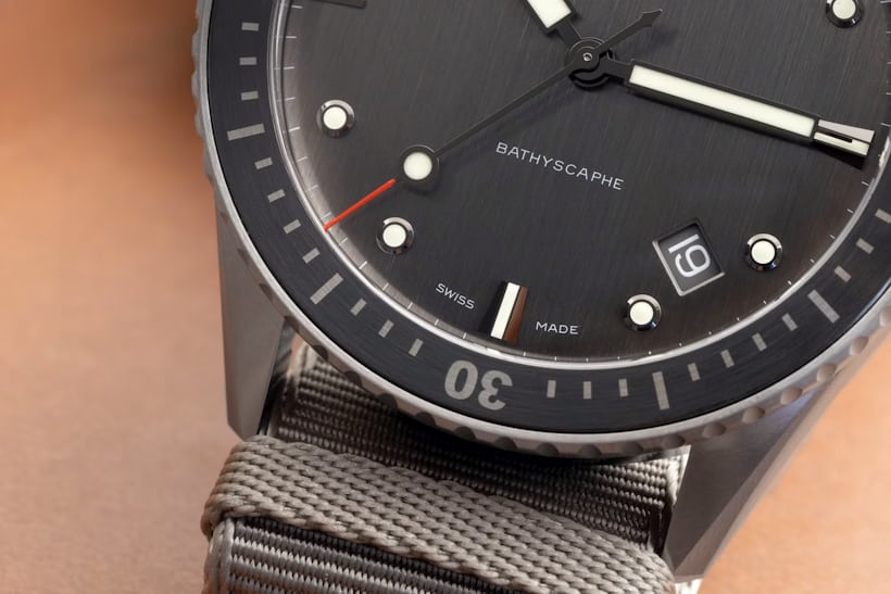 A close-up of the bottom half of the dial on the Blancpain Fifty Fathoms Bathyscaphe Titanium 43mm