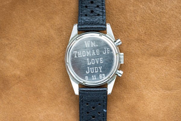 Engraved caseback of a 2447N Carrera watch that reads "WM. THOMAS JR. LOVE JUDY 6 11 63"