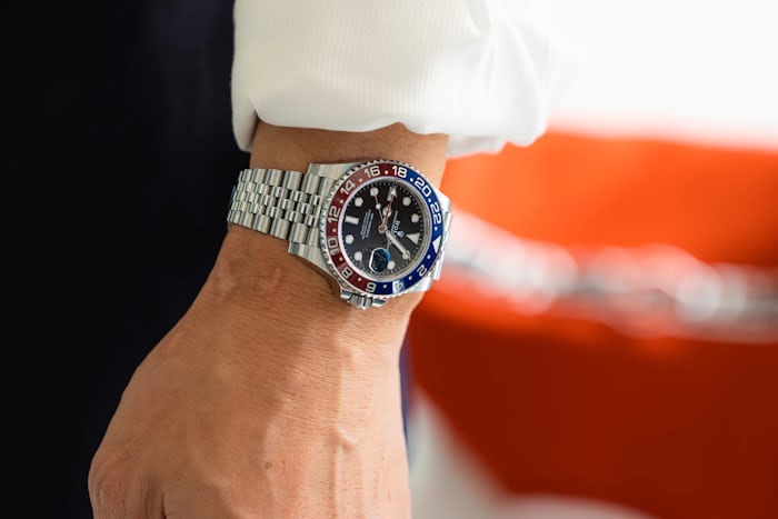 Close up of a man wearing a Rolex GMT-Master II Pepsi on his wrist
