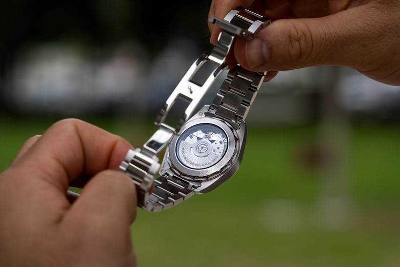 watch being held displaying the see through case back