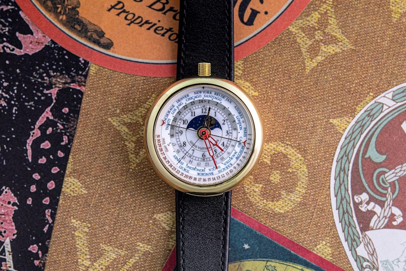 The Louis Vuitton World Timer LV-I wristwatch on an ornately decorated background