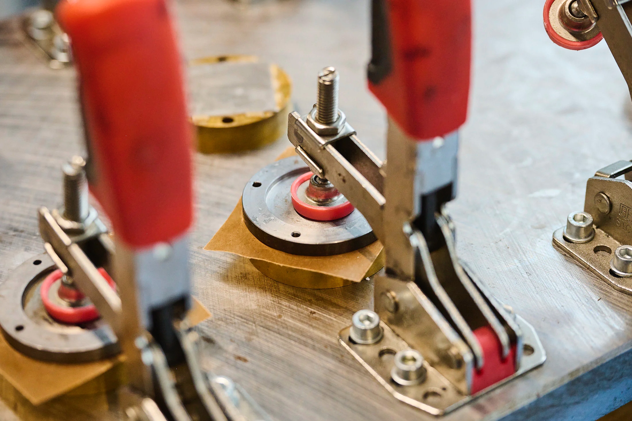 Bonding the material to the base before machining. 