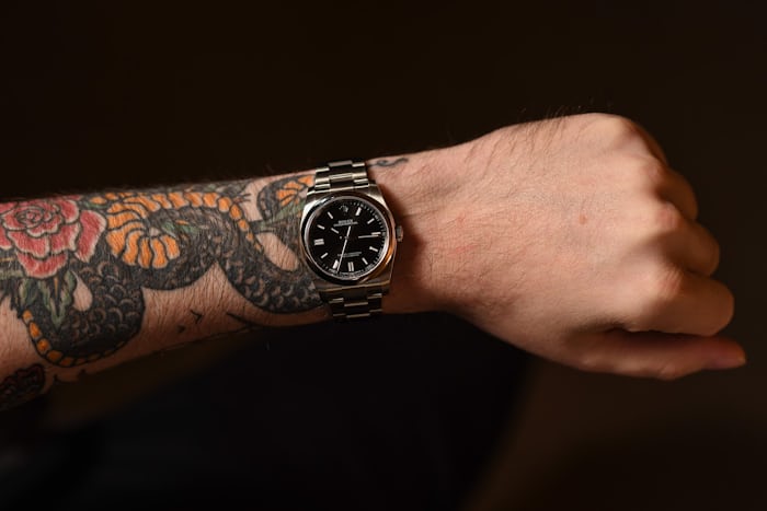 A Rolex Oyster Perpetual on a tattooed arm 
