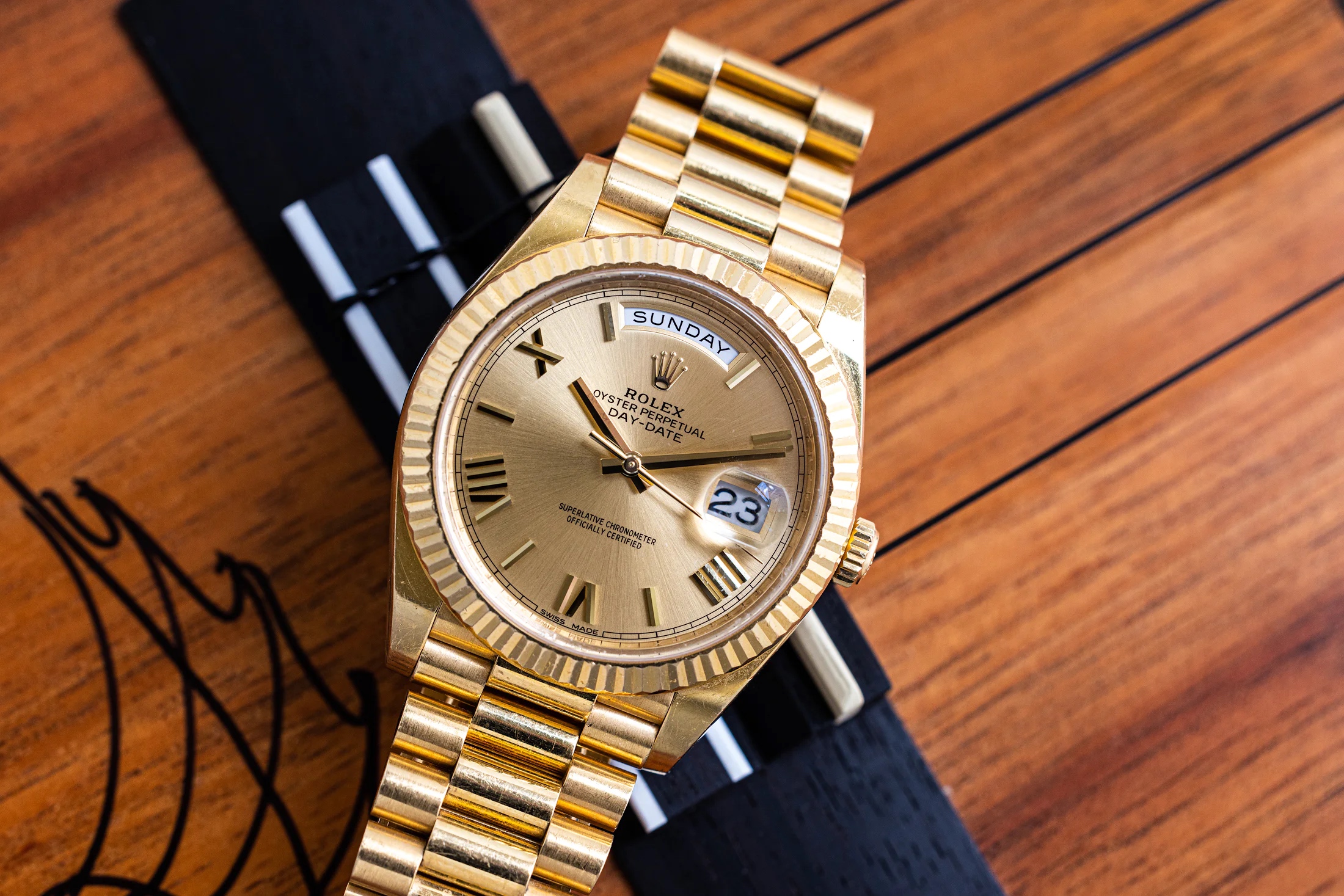 Presidential Rolex Day-Date on a wooden surface