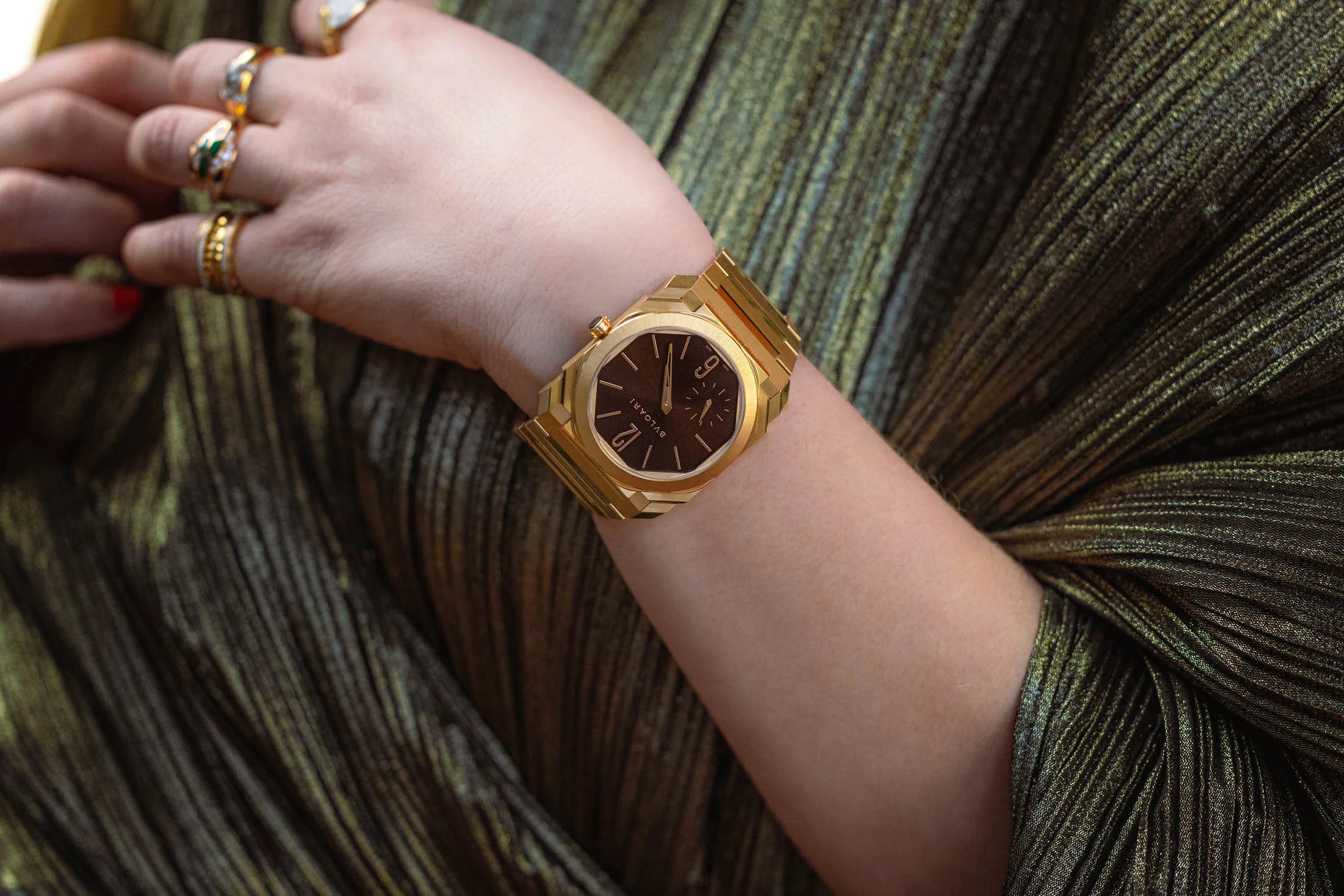Woman wearing a green textured top models the bulgari octo finissimo watch on her wrist Concluding Thoughts