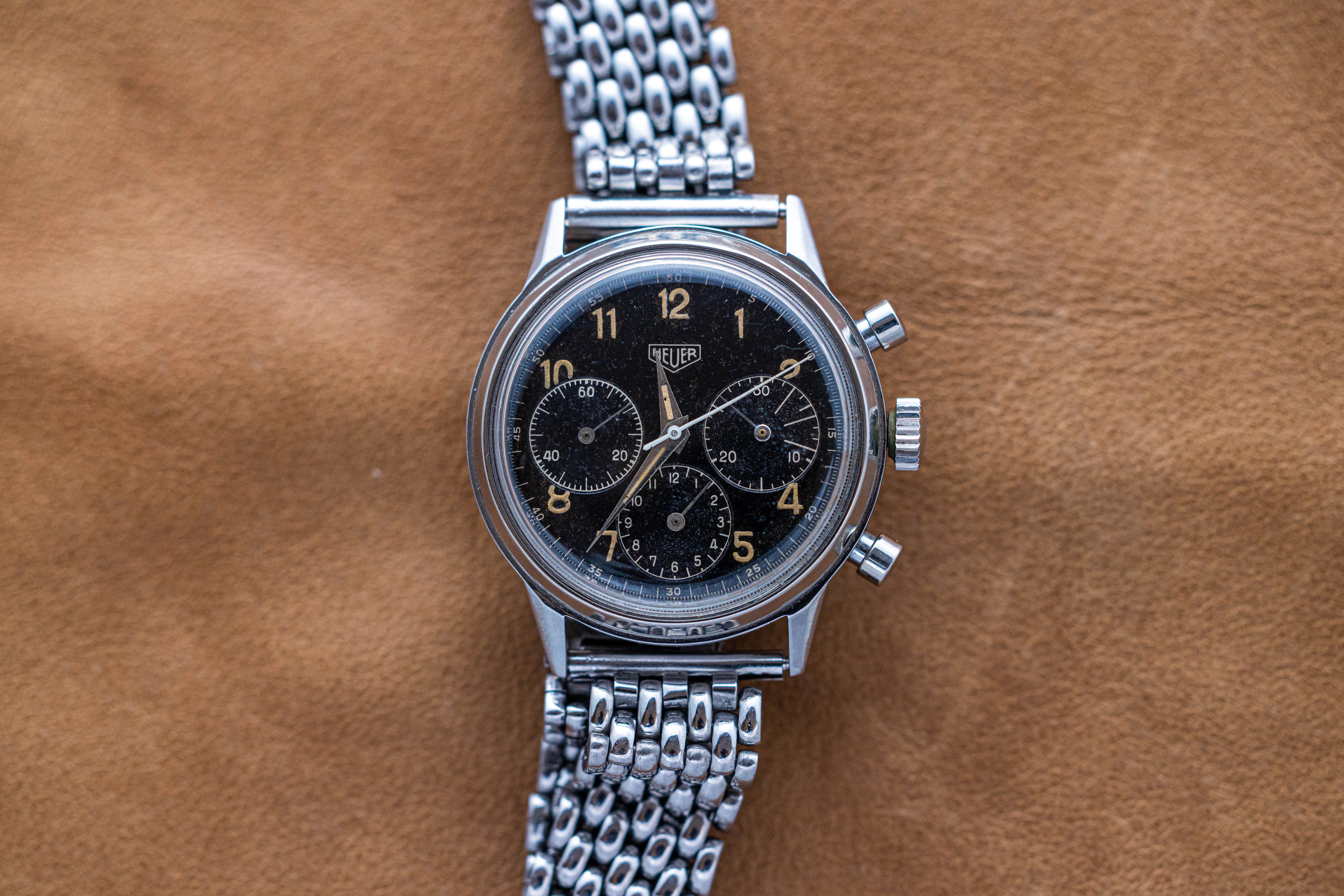 A 2447N pre-carrera laid out on a leather surface