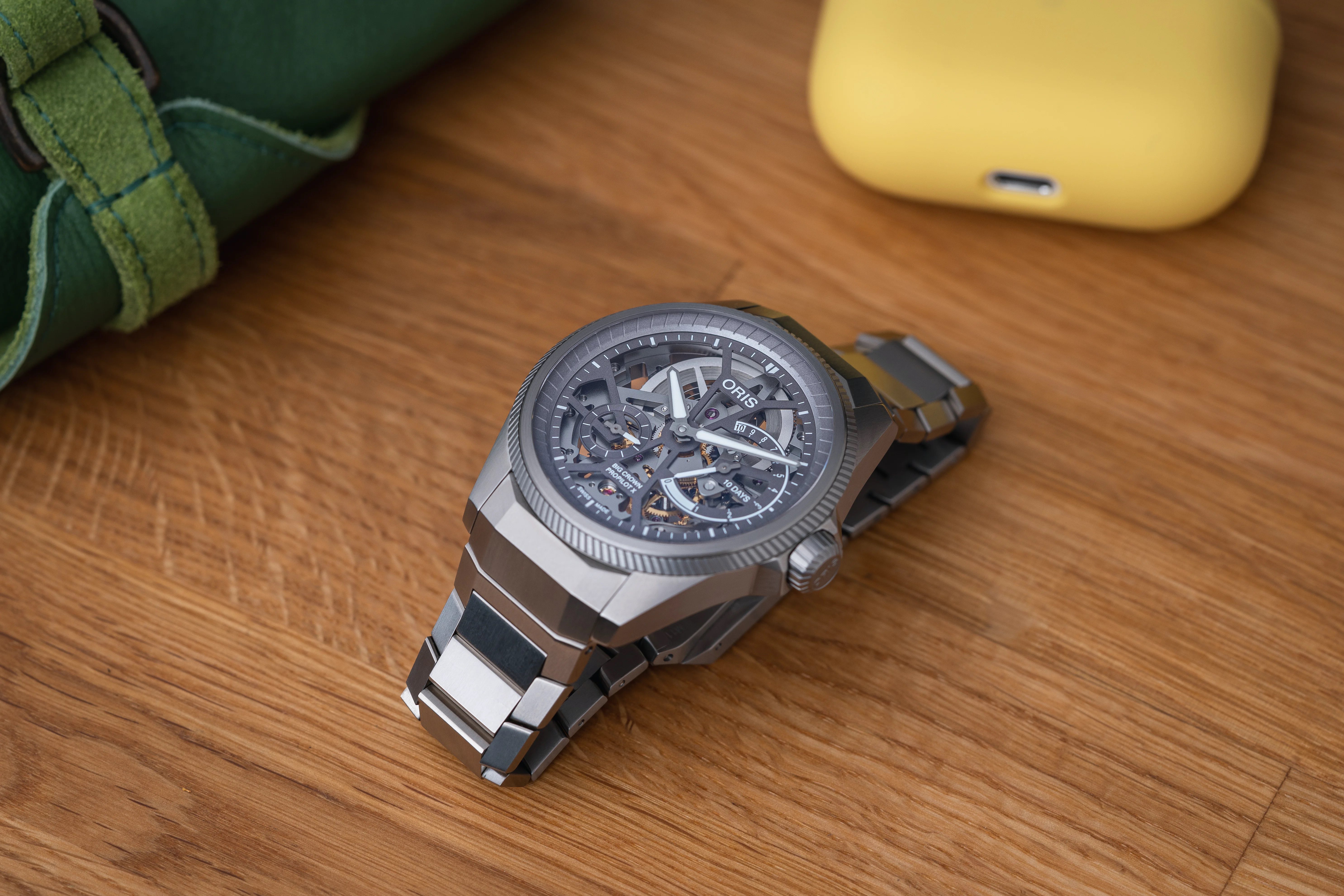 The Oris ProPilot X Calibre 115 resting on a wooden surface