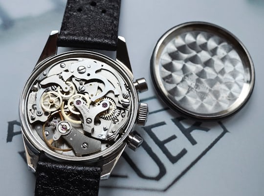Open caseback of a Heuer ref 7753 displaying the caliber valjoux 7730