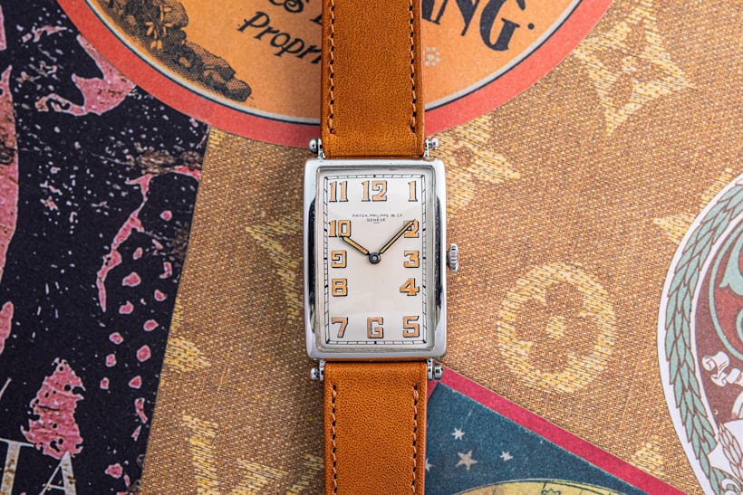 Vintage Patek watch on an ornate background