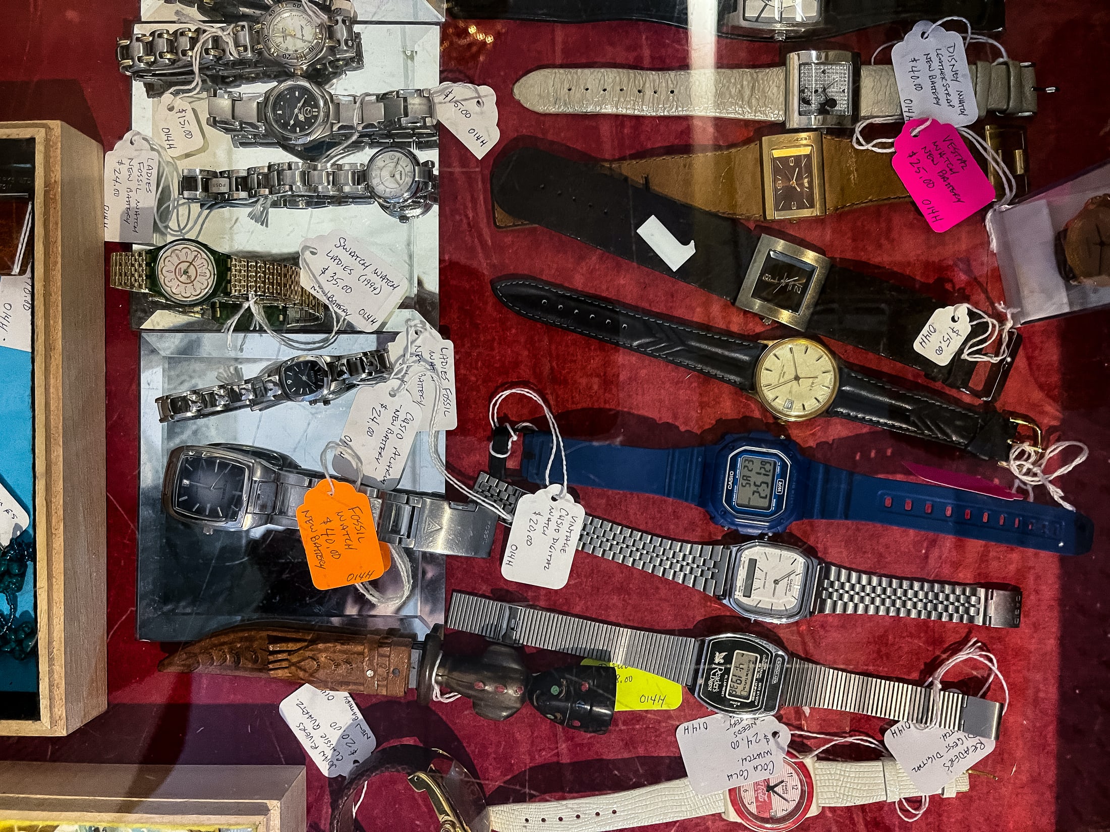 A display cases with several inexpensive digital watches. 