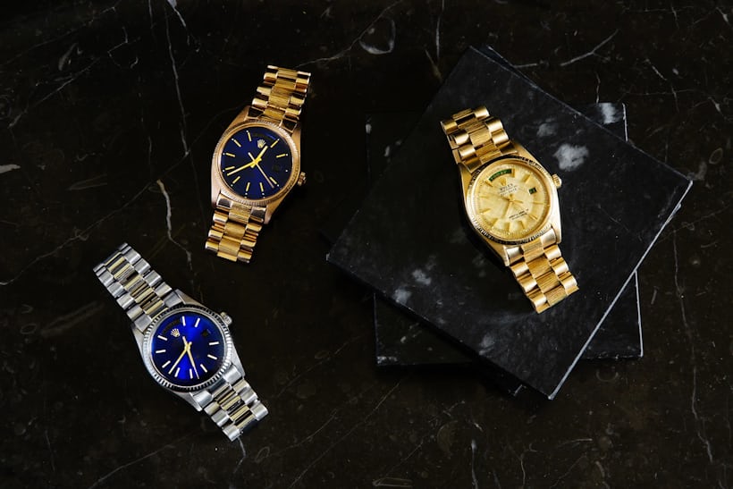 three gold watches