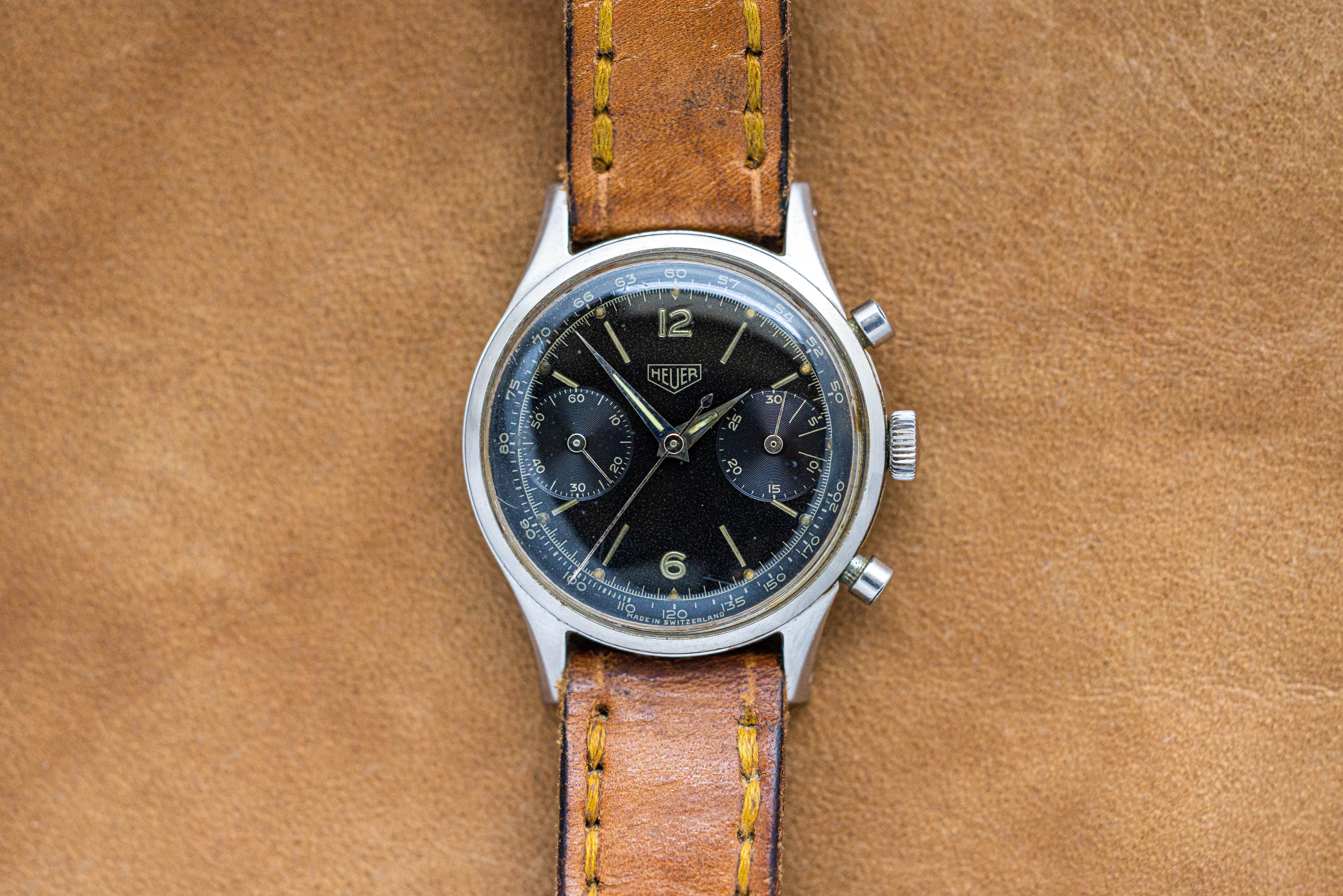 A 3336 Pre-Carrera watch with a tachymeter black dial