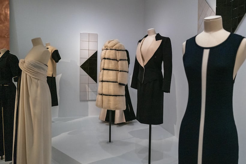Wide shot of a variety of black and white clothing on mannequins on display